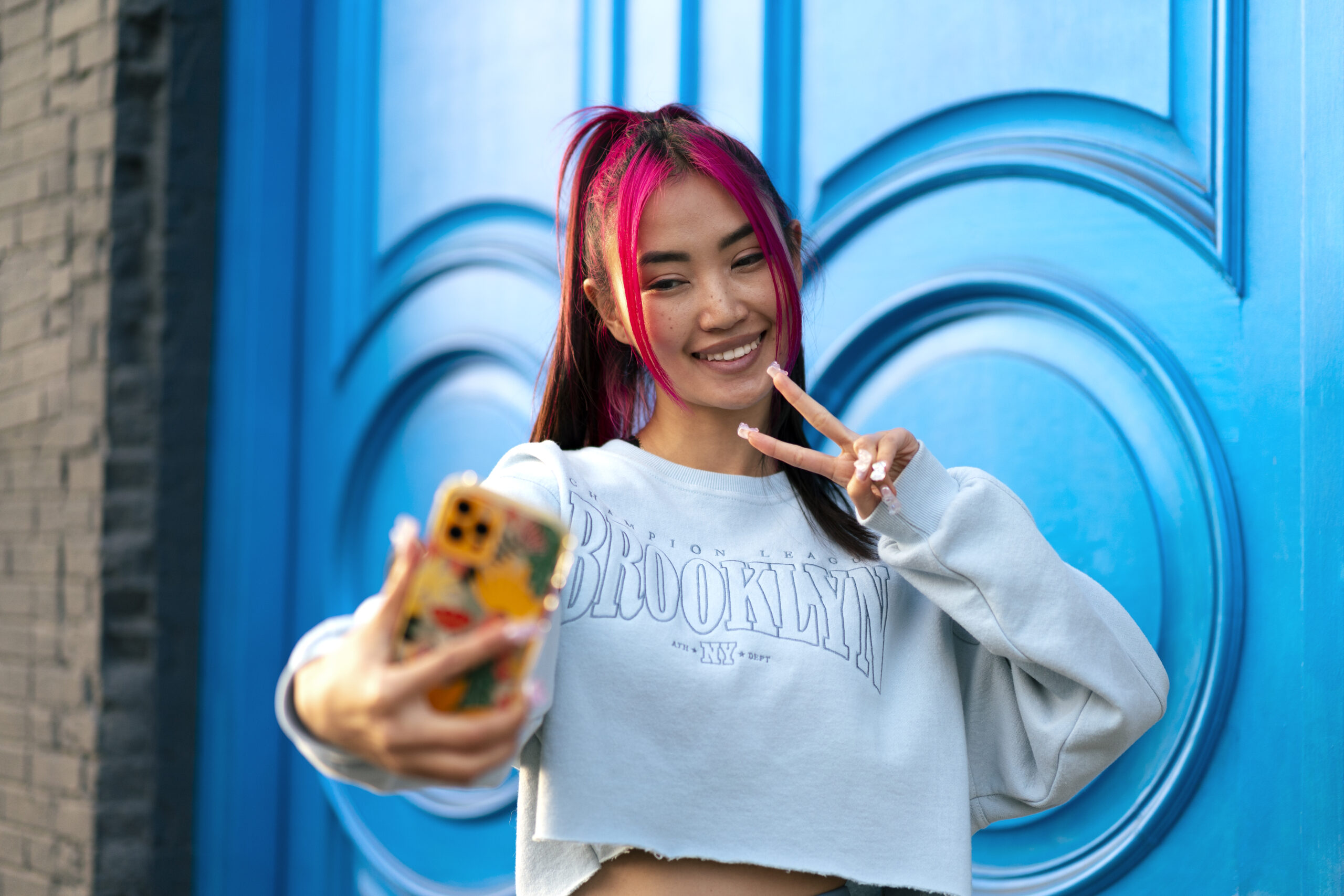young-woman-with-dyed-hair-taking-selfie